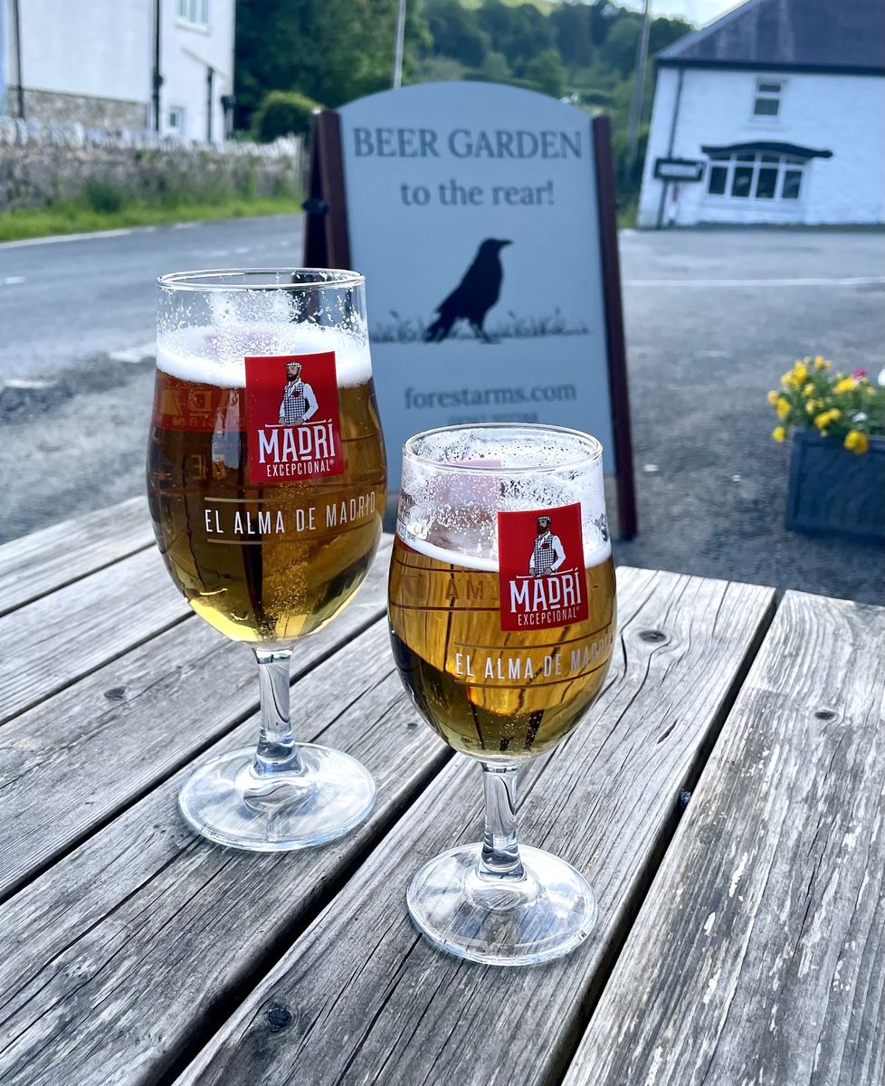 Pints outside, with the beer garden to the rear